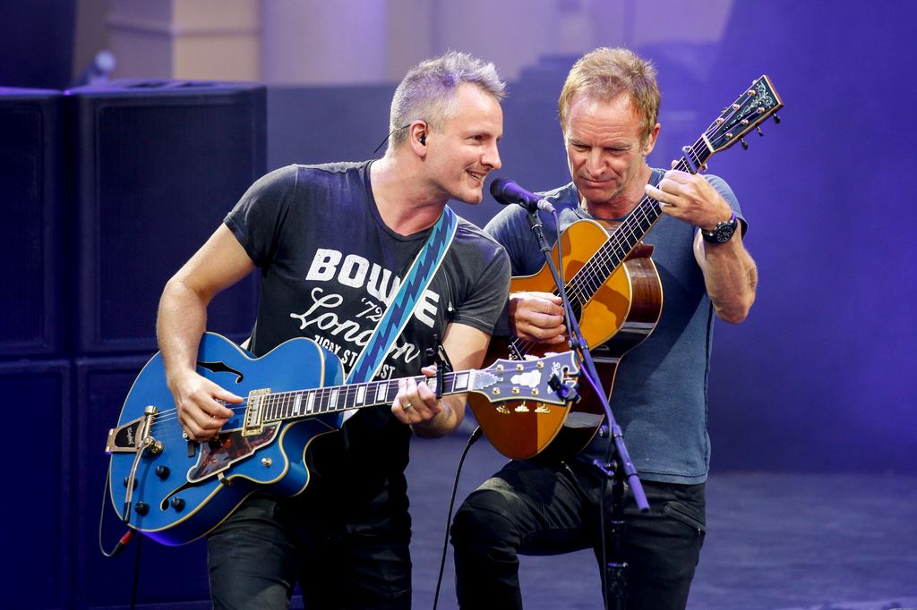 Sting and his son Joe Sumner performing on stage 