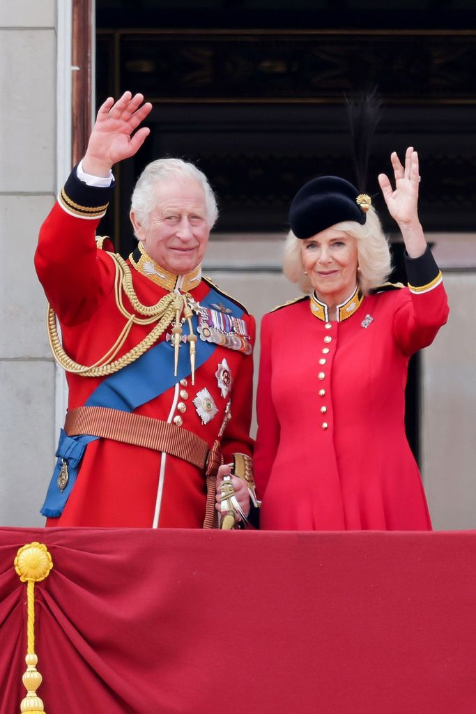 Charles and Camilla wave from the palace balcony at Trooping the Colour