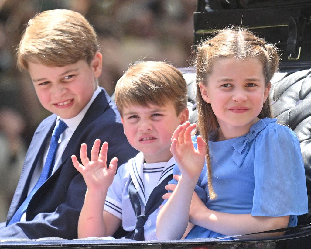 Prince George of Cambridge, Prince Louis of Cambridge and Princess Charlotte of Cambridge ride in a carriage during Trooping the Color
