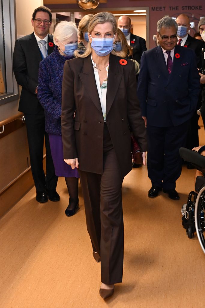 The Duchess of Edinburgh wearing a chocolate brown suit and face mask in Toronto 