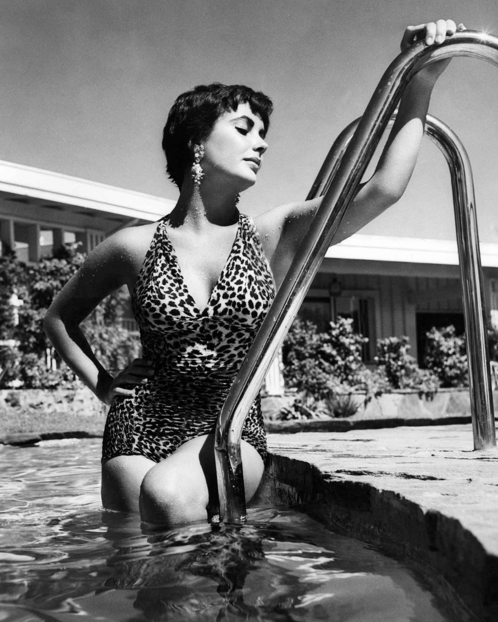 Elizabeth Taylor emerging from the swimming pool in 1955