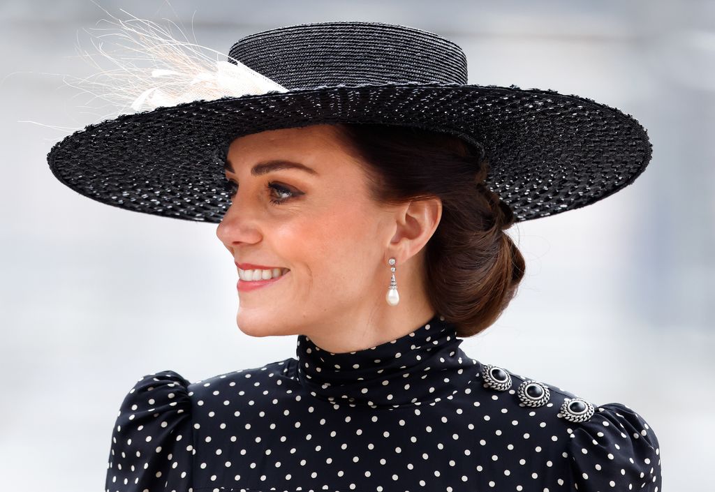Princess Kate wearing black and white polka dots and hat