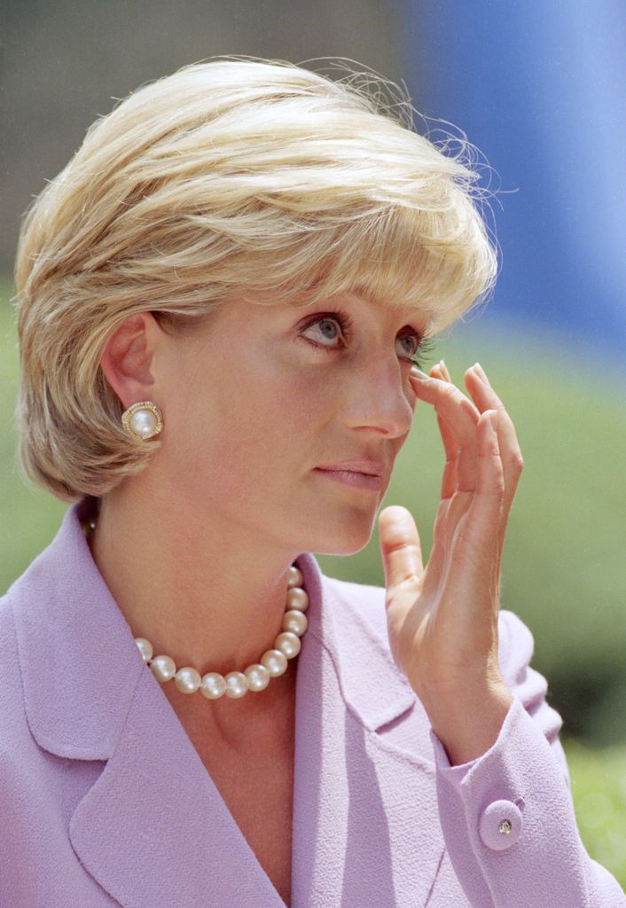 Diana, Princess of Wales visits Washington, USA. Wearing a purple blazer and pearls, she gives an anti-landmines speech at Red Cross Headquarters.