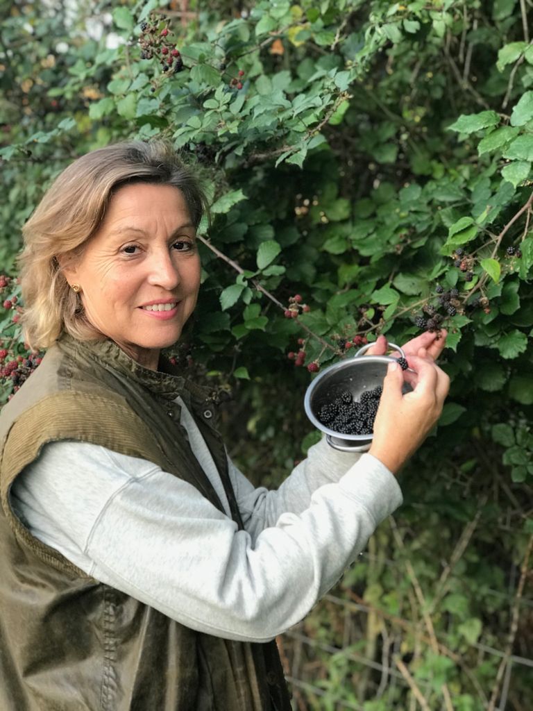 Rebecca Pow MP picking berries in the garden