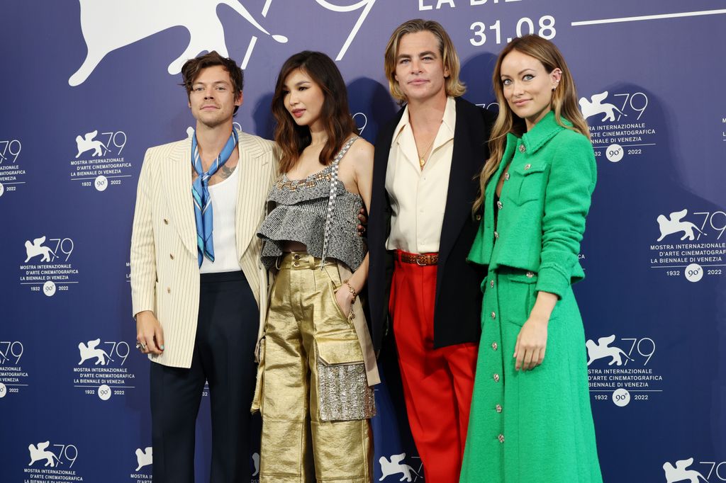 Four people posing at a film premiere