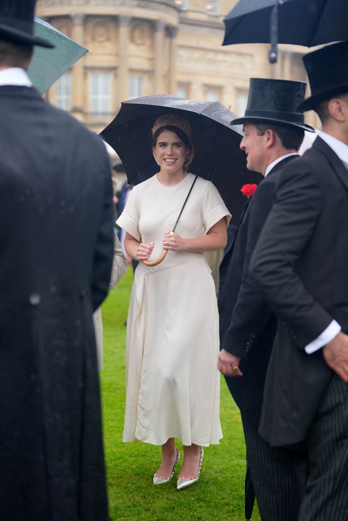 Princess Eugenie wears a white satin dress to the garden party
