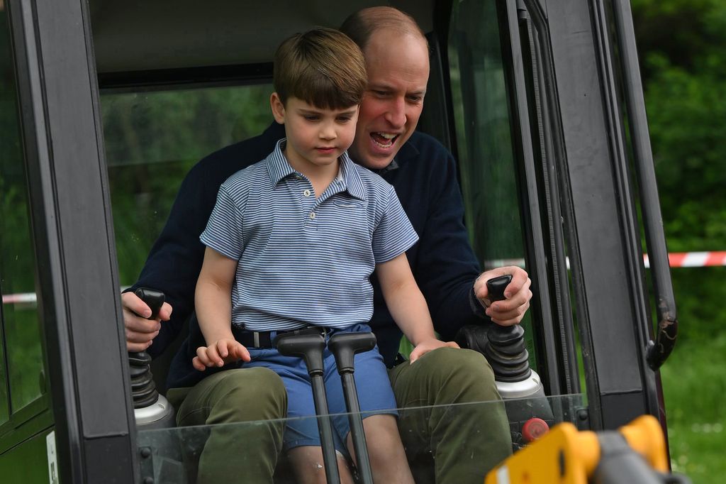 Prince William and Prince Louis digging in an excavator