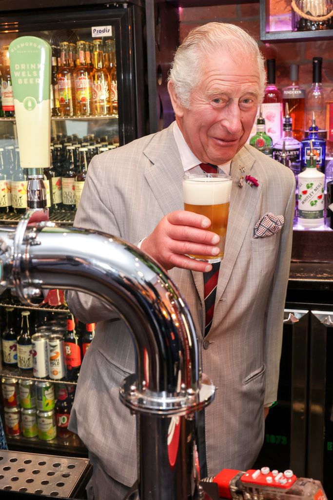 Photo of King Charles holding a beer 