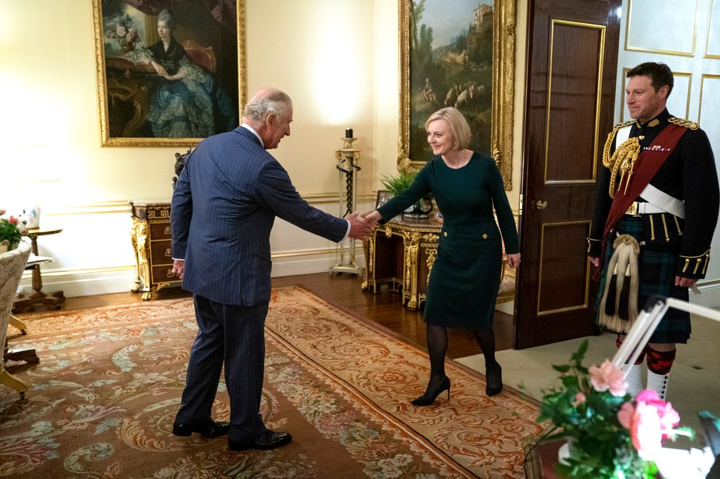 King Charles shaking hands with Liz Truss