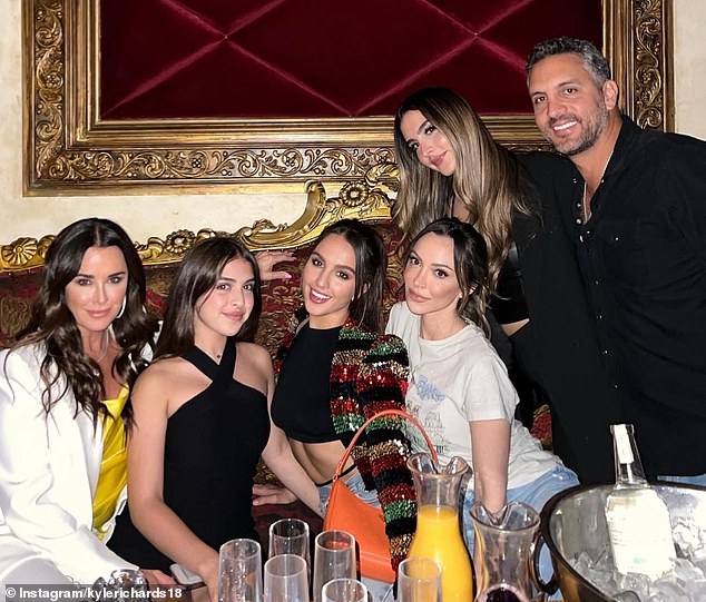 Kyle and Mauricio are pictured with their three daughters Alexia, 27, Sophia, 24, and Portia, 16, as well as Kyle's eldest daughter Farrah, 35.