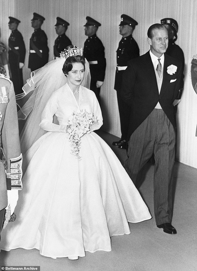 Prince Philip walks Princess Margaret down the aisle on their wedding day