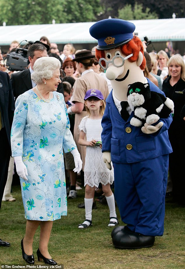 Queen Elizabeth II meets Postman Pat and his black and white cat Jess and other fairytale characters at a children's party at the Palace. This was a children's literacy garden party hosted by the Queen to celebrate her 80th birthday in 2006.