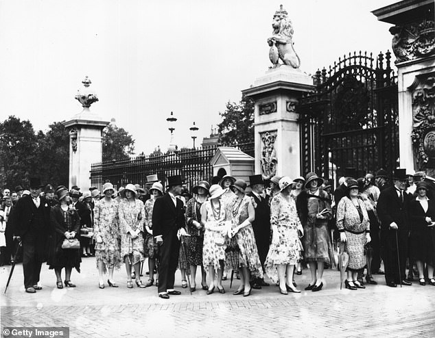 Guests wait patiently for the garden party outside Buckingham Palace in 1920