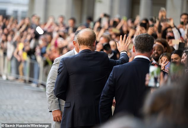 Prince Harry waved to fans waiting to meet him outside St Paul's Cathedral yesterday