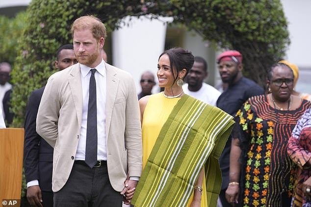 Meghan was also gifted a traditional shawl which perfectly matched her canary yellow Carolina Herrera dress