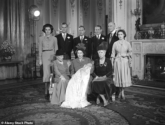 Princess Elizabeth poses with her first son Charles after his christening. Seated to the right is Elizabeth's grandmother Queen Mary