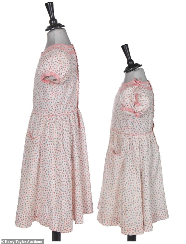 These matching dresses were originally worn by Princess Elizabeth and Princess Margaret in 1936. They are expected to sell for up to £5,000