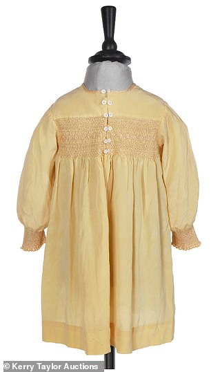 Young Elizabeth's dress features a mock yoke bodice and cuffs