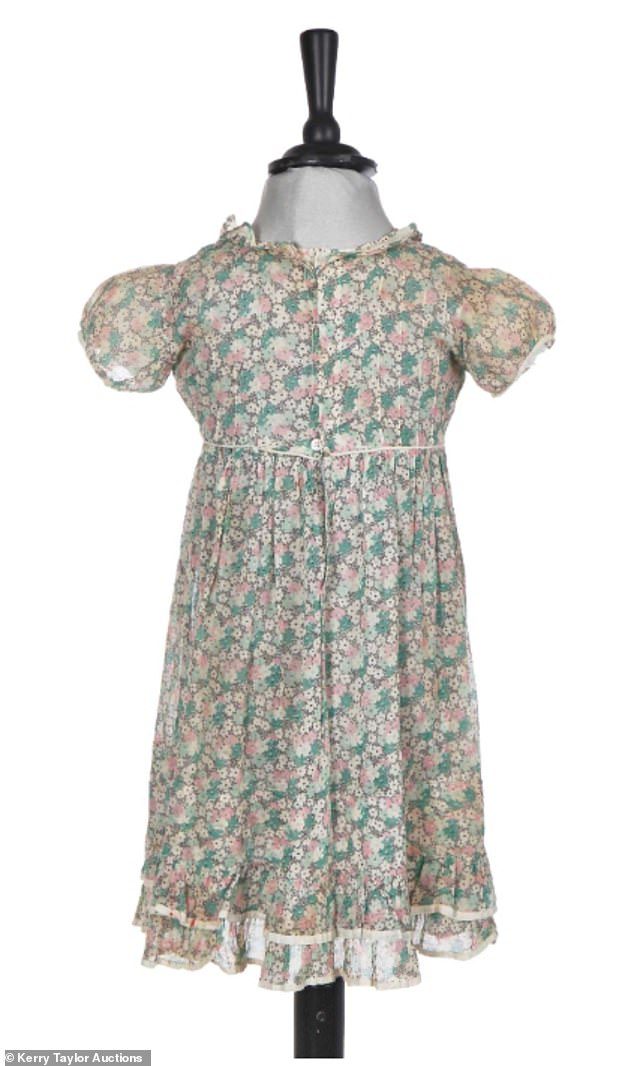 A set of dresses worn by Princess Elizabeth and her sister Margaret is set to sell at auction for more than £12,000. Above: A pink and green floral dress worn by Elizabeth in the 1930s. It is expected to sell for up to £3,000