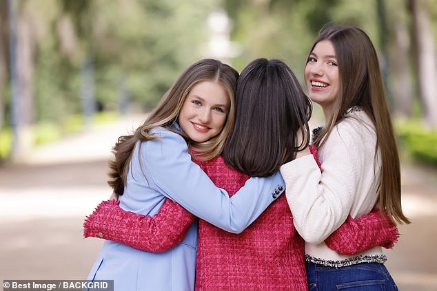 Close; A sweet photo of Queen Letizia hugging her daughters was also released in the official anniversary set
