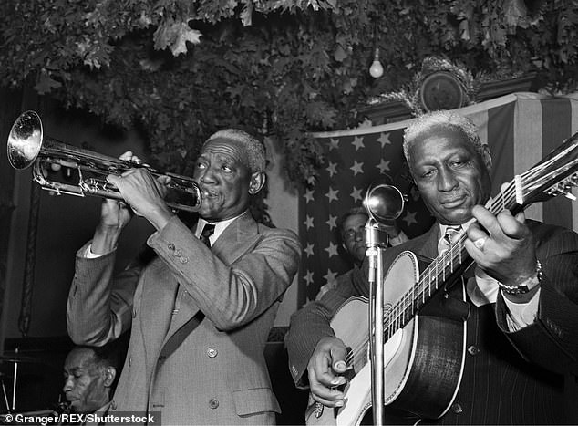 The phrase 'stay woke' was first used by blues singer Lead Belly (right) in the 1930s to warn fellow African Americans to be cautious when traveling through more dangerous parts of America.