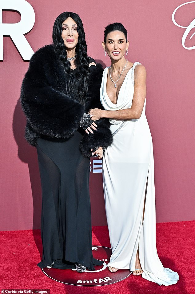 Earlier on the red carpet Demi and Cher posed together in contrasting gowns, with Demi wearing white and Cher opting for a black outfit