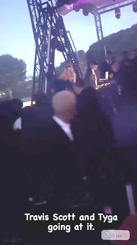 Travis is said to have taken the microphone from Akiva, prompting Edwards (pictured front center), who was chumming up with Tyga earlier in the evening, to say something to him