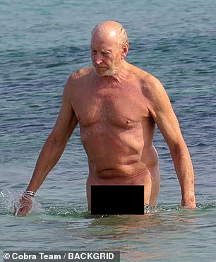 Charles showed off his toned physique as he strolled along the sands of a nudist beach before taking a dip in the ocean