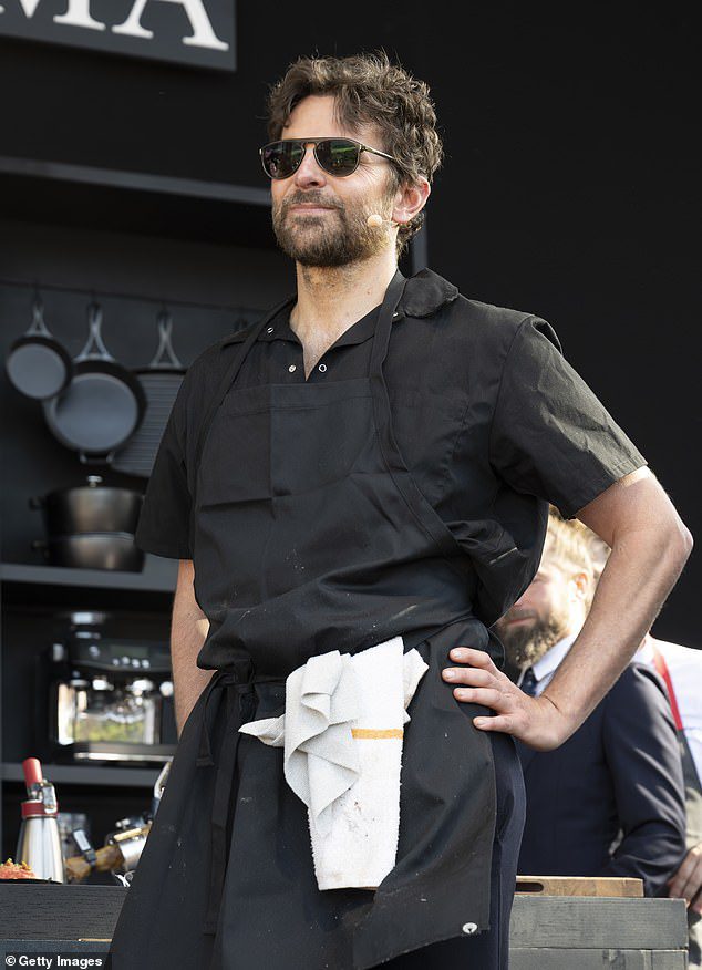 Bradley Cooper, 49, displays his cooking skills onstage while girlfriend Gigi Hadid, 29, shows her support at BottleRock Food and Music Festival