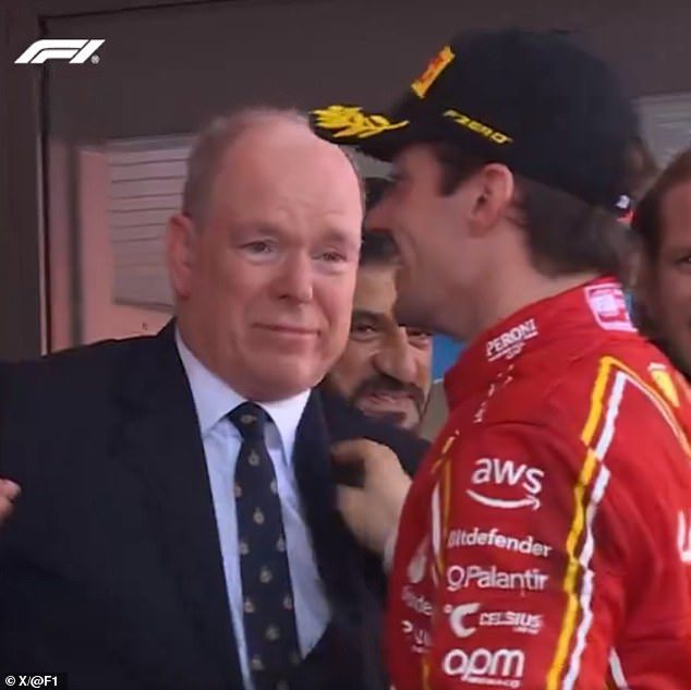 Prince Albert tearfully hugs Charles Leclerc as he becomes the first Monegasque winner of the Circuit de Monaco – before drinking champagne straight from an extra large bottle