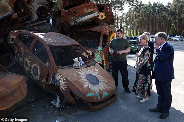 Sophie, 59, last month became the first member of the royal family to visit the country since Russia's invasion in February 2022. She and the United Kingdom's ambassador to Ukraine Martin Harris are pictured visiting a car cemetery in Irpin, Ukraine, on April 29, 2024.