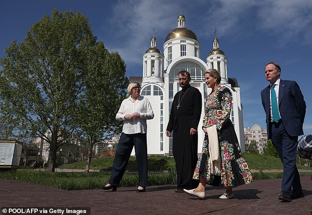The Duchess of Edinburgh (second from right) and the United Kingdom's Ambassador to Ukraine Martin Harris (right) visiting the memorial to the victims of the Russian occupation in the city of Bucha on April 29, 2024