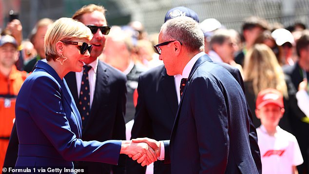 Princess Charlene shook hands wth Stefano Domenicali, CEO of the Formula One Group, on the grid prior to the race