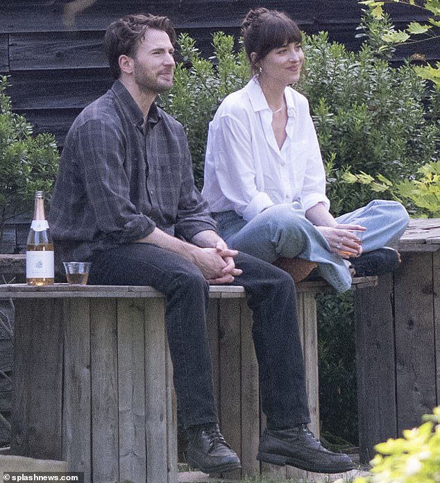 Dakota Johnson shares a bottle of wine with Chris Evans while shooting The Materialists… after she was seen kissing Pedro Pascal for the same film