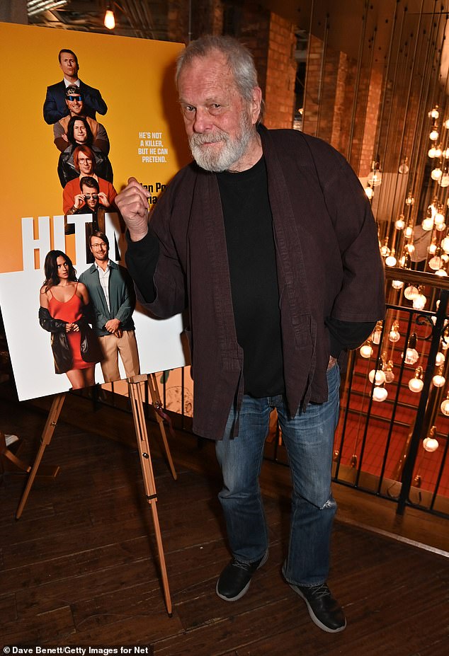 The Monty Python star struck a fun pose in front of the film's poster as he arrived in a totally casual outfit consisting of a jacket, T-shirt and jeans.