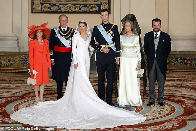King Felipe and Queen Letizia and their parents on the couple's wedding day in May 2004