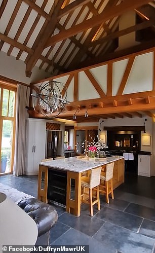 The home has a large kitchen area that also has a marble island