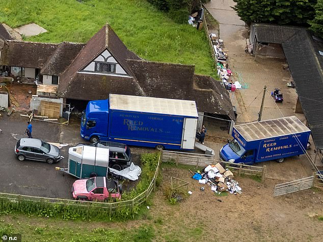 Reed Removals workers were seen lifting furniture into the back of the van