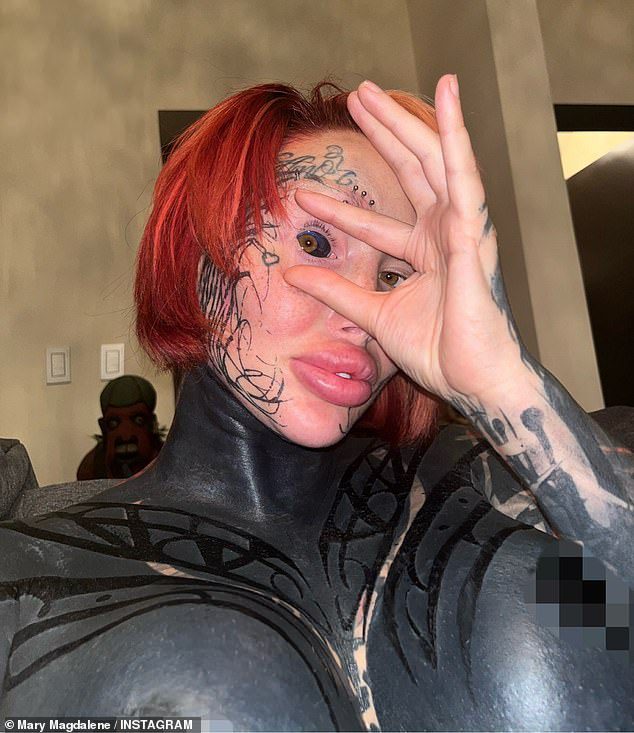 Surgery-addicted model tattoos her EYEBALL after almost dying from botched procedures that included an ‘inflated’ vagina and a uniboob – as fans say she’s finally gone too far