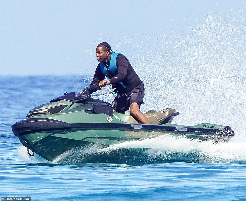 Wearing a blue lifejacket to match his outfit, he appeared to be in a cheery mood as he made waves in the Mediterranean waters