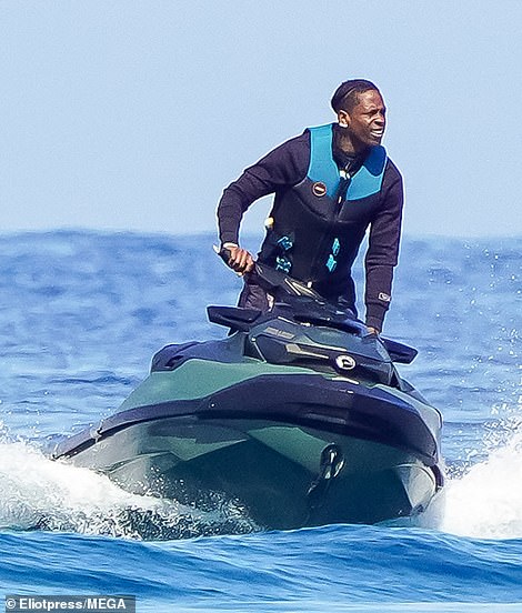 With the sun on his face, he was seen maneuvering the jet ski with finesse and riding around in circles