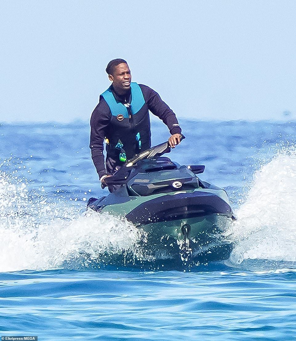Travis Scott appeared to be decompressing with family on Tuesday in St. Tropez as he was pictured with his daughter Stormi on a boat, and later jet-skiing