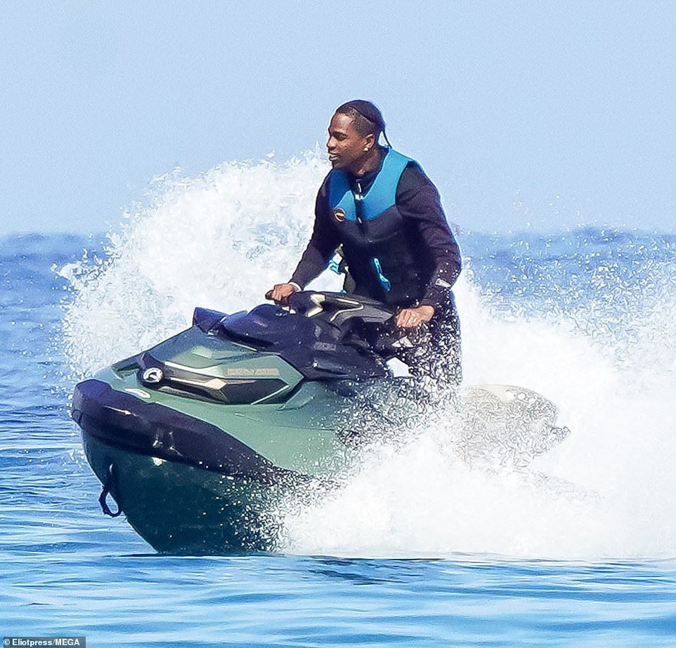 He stood up as he jet-skied after enjoying a ride with his kids from a dinghy to their boat