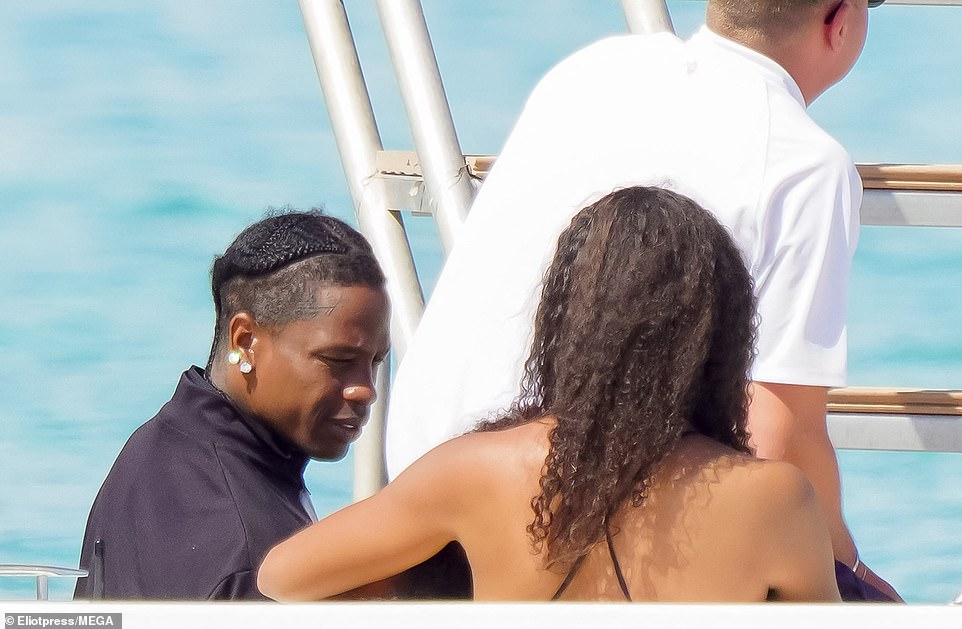 Travis kept a close eye on his kids and was seen talking to Stormi, who was sitting in the mystery woman's lap, as they enjoyed their boat ride