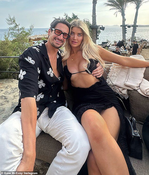 Anna McEvoy raises eyebrows in a wild cut-out gown which almost exposes her chest during her Greek honeymoon – and her new husband is a big fan