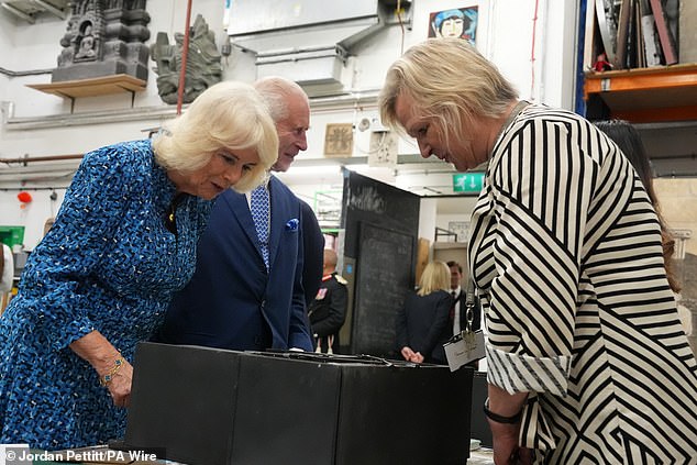 King Charles III and Queen Camilla tour the Scenic Art Studio during a visit to Rada today