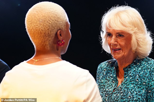 Queen Camilla speaks to students at the Royal Academy of Dramatic Art in London today