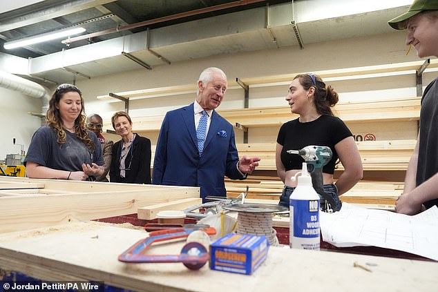 King Charles III speaks to students at the Scenic Art Studio during a visit to Rada today