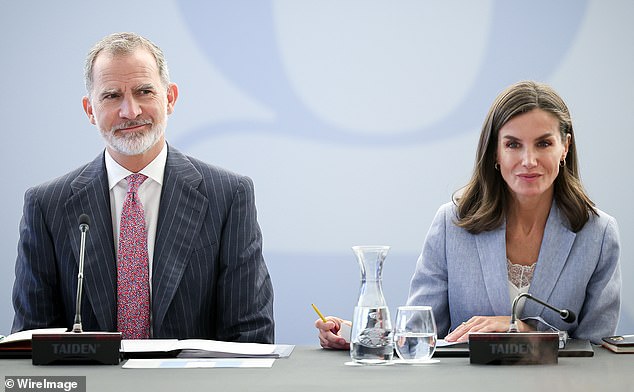 King Felipe (pictured left) stepped out in a smart suit and white shirt for today's outing