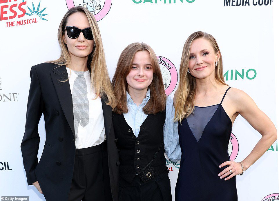 Angelina Jolie looks triumphant while posing with daughter Vivienne, 15, on red carpet after her girls deliver devastating blow to dad Brad Pitt amid ugly divorce war
